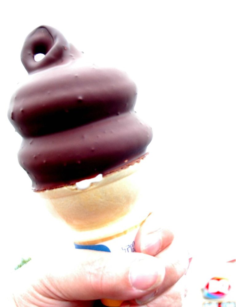 Chocolate dipped vanilla ice cream cone, swirl, hand held, Dairy Queen, Facto…