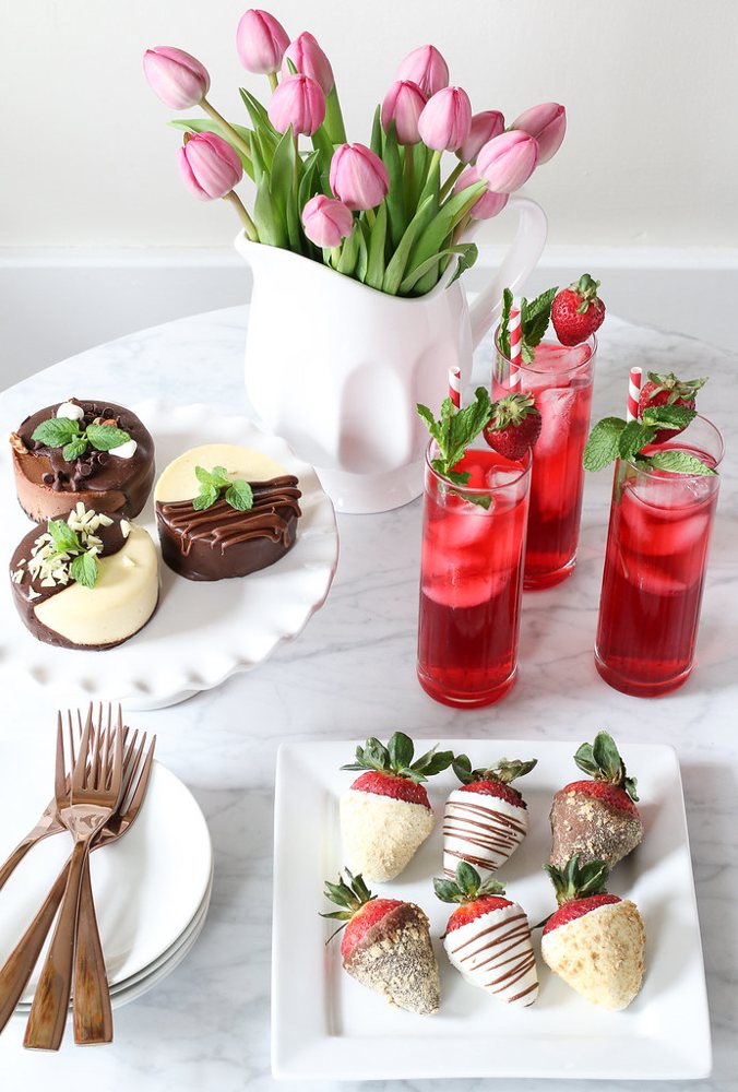 Hibiscus Iced Tea Cooler with vodka and mint leaves in tall glasses with stra…