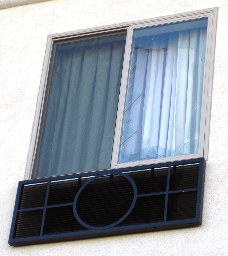 Hailstone-smashed window from 4 July 2010 hailstorm (2nd floor of west-facing…