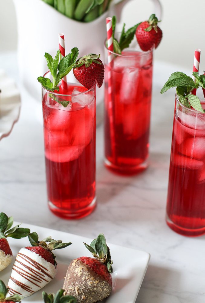 Hibiscus Iced Tea Cooler with vodka and mint leaves in tall glasses with stra…