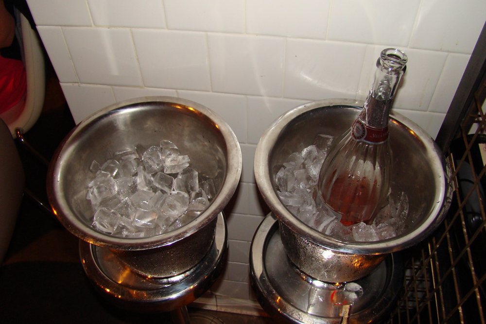 The champagne buckets next to the dinner table