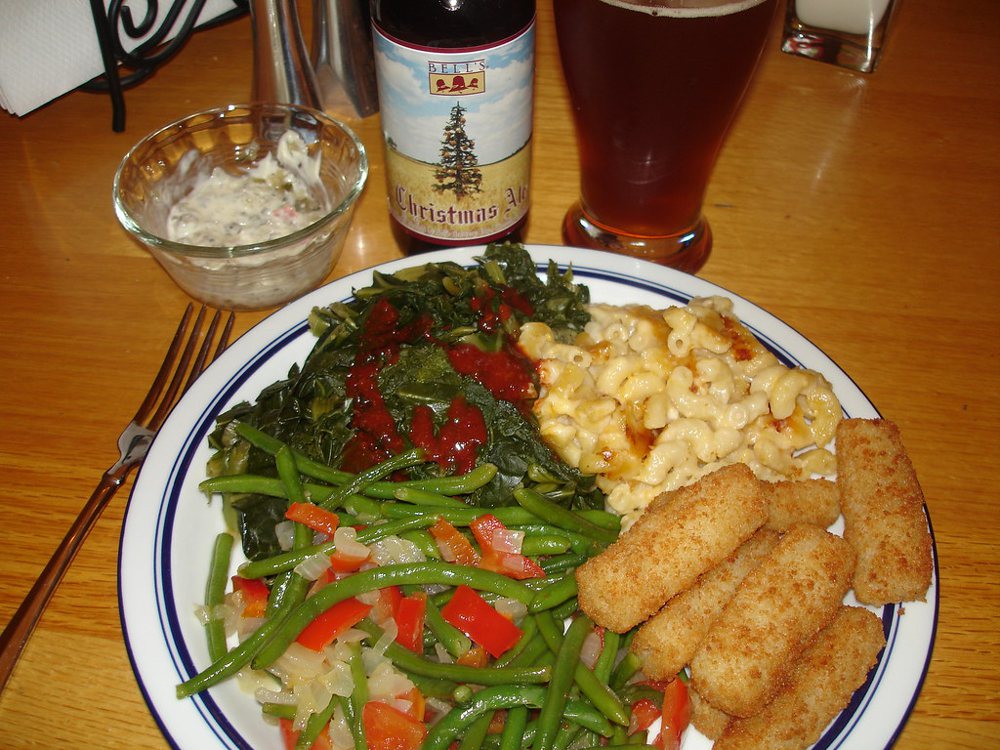 Oven baked cod sticks with macaroni and cheese, mixed greens, and green beans…